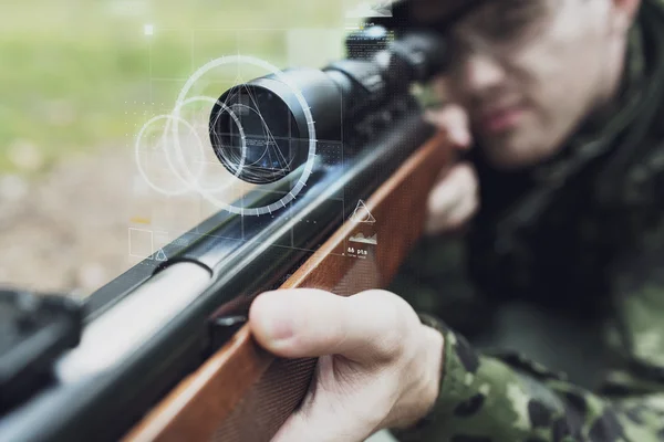 Close up of soldier or sniper with gun in forest — Stock Photo, Image