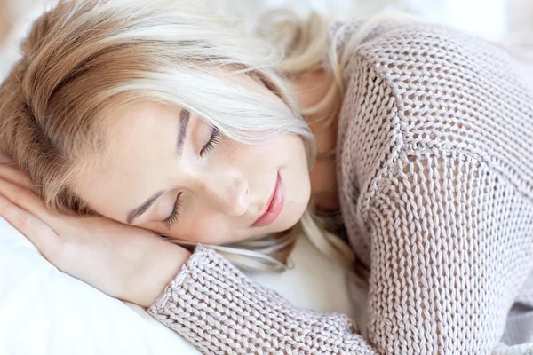 Woman or teenage girl sleeping on pillow at home — Stock Photo, Image