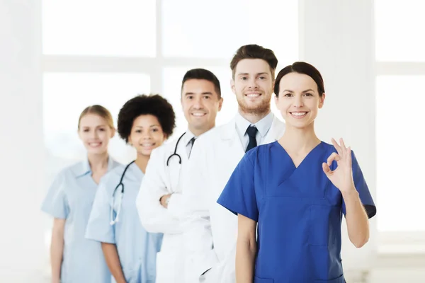 Group of happy doctors at hospital — Stock Photo, Image