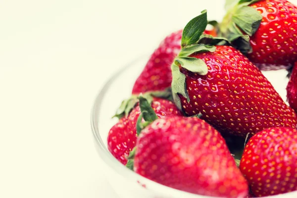 Close up of ripe red strawberries over white — Stock Photo, Image