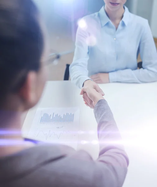 Two calm businesswoman shaking hands in office — Stock Photo, Image