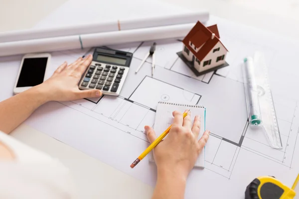 Close up of architect hand counting on calculator — Stock Photo, Image