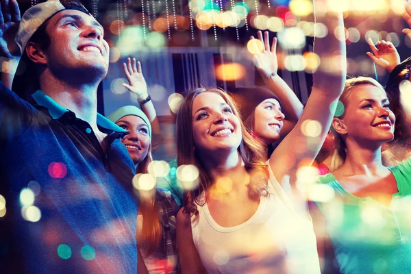 Group of happy friends at concert in night club — Stock Photo, Image