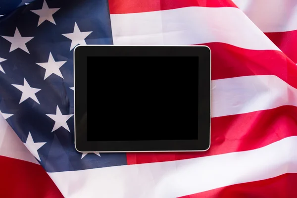 Close up of tablet pc computer on american flag — Stock Photo, Image