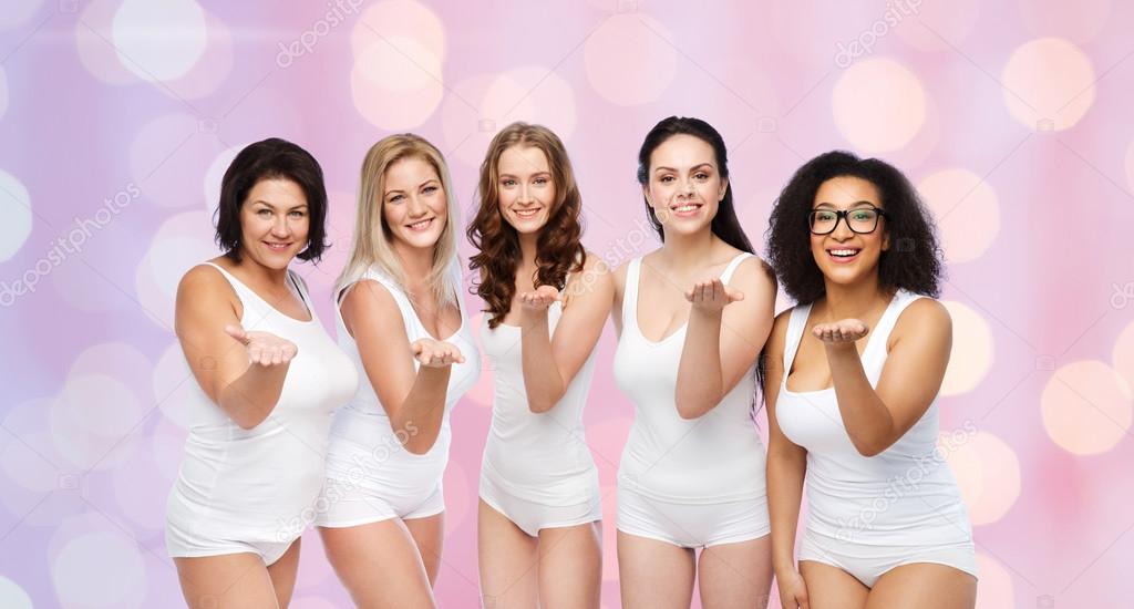 Group of Happy Women in White Underwear Having Fun Stock Photo