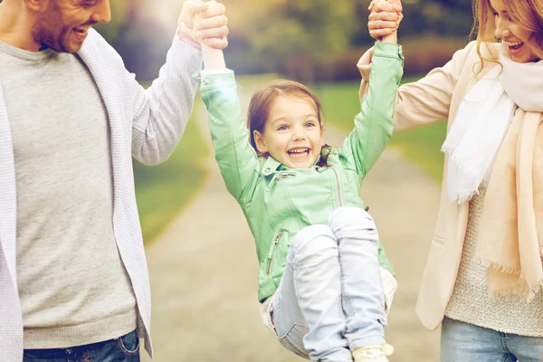 Happy family walking in summer park and having fun — Stock Photo, Image