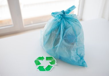 close up of rubbish bag with green recycle symbol clipart