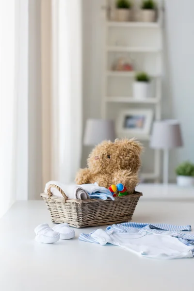 close up of baby clothes and toys for newborn