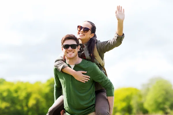 Happy couple with backpacks having fun outdoors Stock Picture