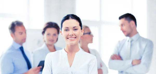 Smiling attractive businesswoman in office — Stock Photo, Image
