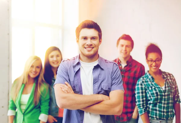 Student boy with group of students — Stock Photo, Image