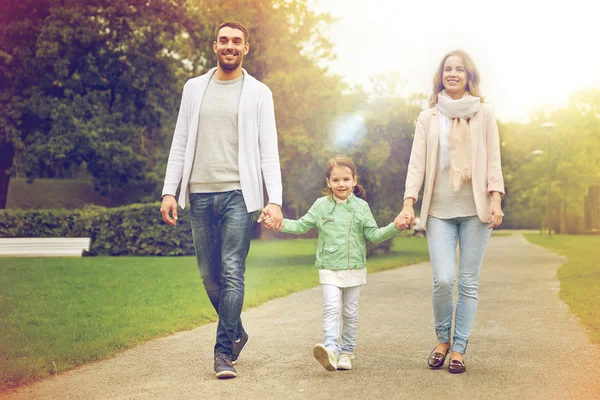 Happy family walking in summer park — Stock Photo, Image