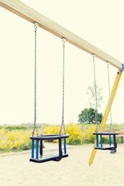 Baby swing on playground outdoors — Stock Photo, Image