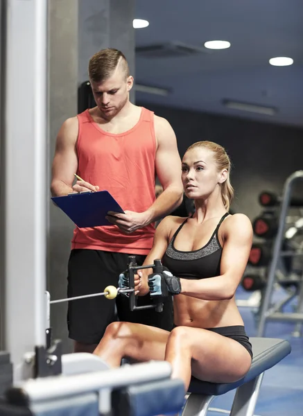 Man and woman flexing muscles — Stock Photo, Image