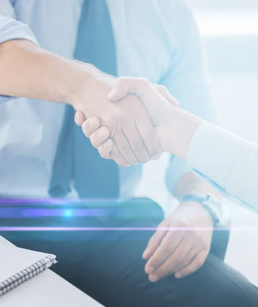 Businessmen shaking hands in office — Stock Photo, Image
