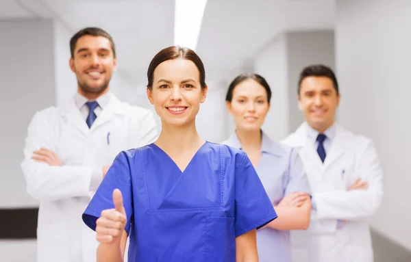 Medics or doctors at hospital — Stock Photo, Image