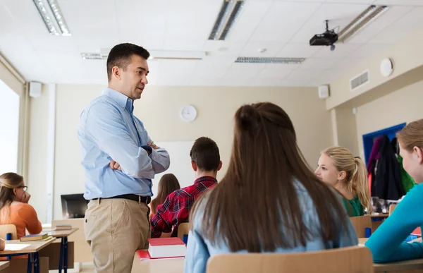 Group of students and teacher at school — Stock Photo, Image