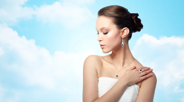 Beautiful woman with earring, ring and pendant — Stock Photo, Image