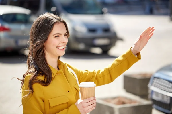 Happy young woman drinking coffee — Stock Photo, Image