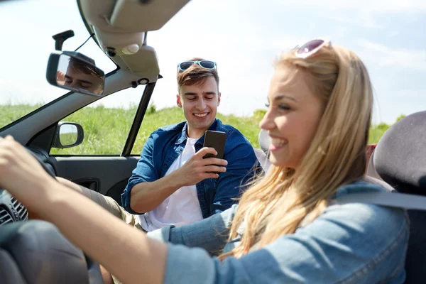 Man photographing woman driving car — Stock Photo, Image