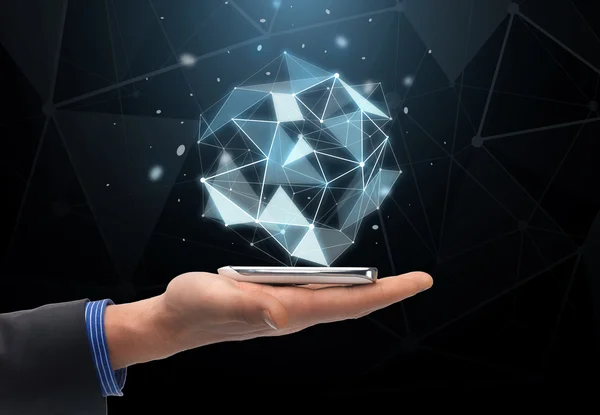 Close up of hand with projection and smartphone — Stock Photo, Image