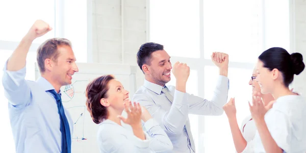 Business team celebrating victory in office — Stock Photo, Image