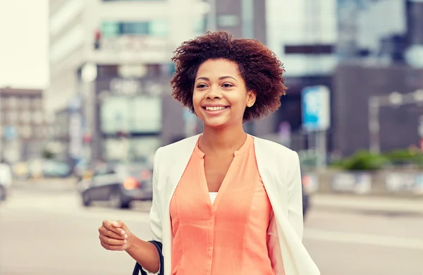 Happy young african american businesswoman in city — Stock Photo, Image