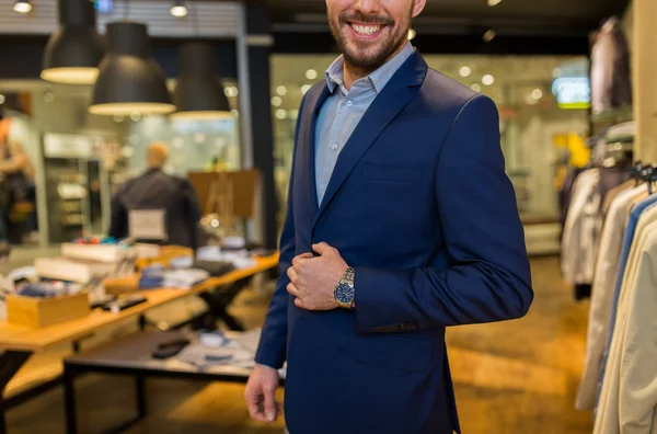 Close up of happy man in suit at clothing store — Stock Photo, Image