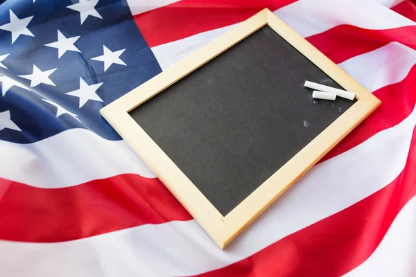 Close up of school blackboard on american flag — Stock Photo, Image