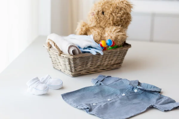 Close up of baby clothes and toys for newborn — Stock Photo, Image