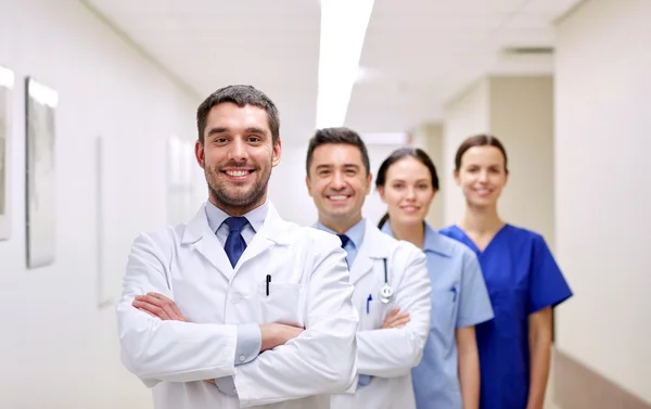 Group of happy medics or doctors at hospital — Stock Photo, Image