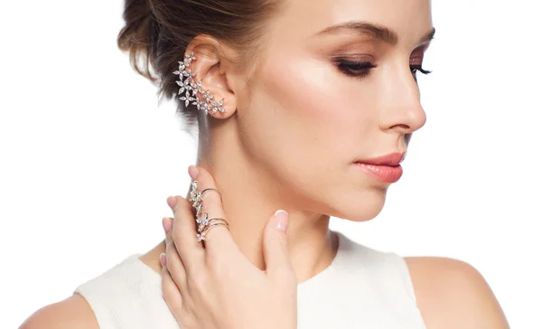 Smiling woman in white dress with diamond jewelry — Stock Photo, Image