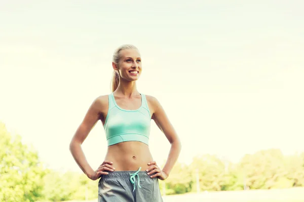 Happy young woman exercising outside — Stock Photo, Image