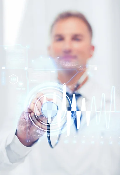 Male doctor with stethoscope and cardiogram — Stock Photo, Image