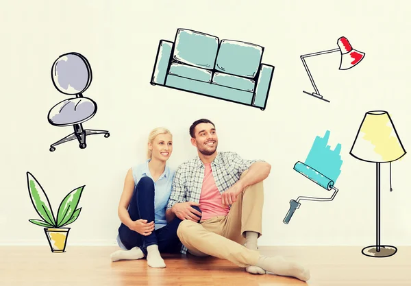 Happy couple of man and woman moving to new home — Stock Photo, Image