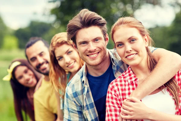 Group of smiling friends outdoors — Stock Photo, Image