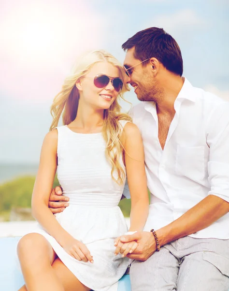 Couple in shades at seaside — Stock Photo, Image