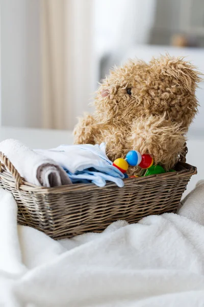 Close up of baby clothes and toys for newborn — Stock Photo, Image