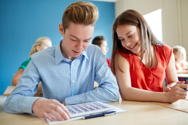 Happy students with tablet pc computer at school — Stock Photo, Image