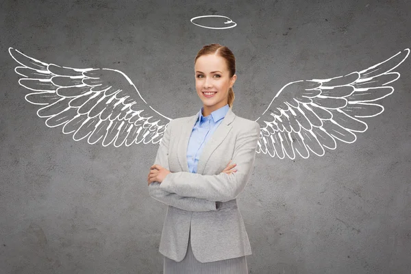 Happy businesswoman with angel wings and nimbus — Stock Photo, Image