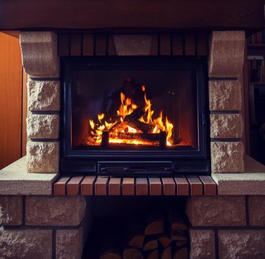 close up of burning fireplace at home clipart