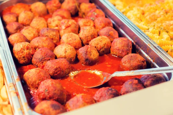 Close up of meatballs and other dishes on tray — Stock Photo, Image