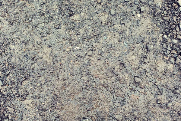 Close up of wet gray gravel road or ground — Stock Photo, Image