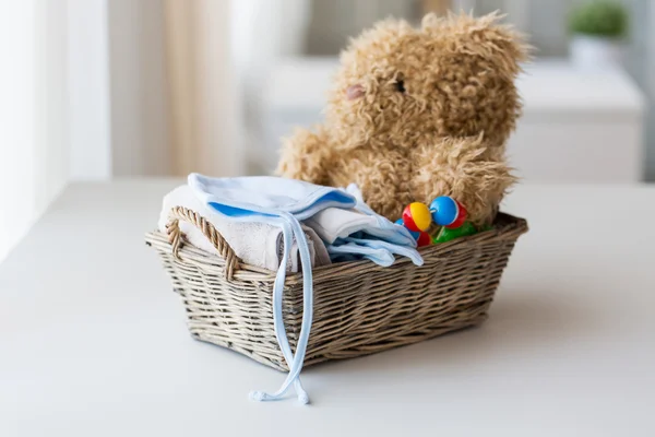 Close up of baby clothes and toys for newborn — Stock Photo, Image