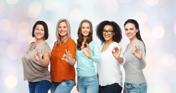 Group of happy different size women showing ok Royalty Free Stock Images