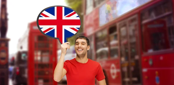Man with text bubble of british flag in London — стоковое фото