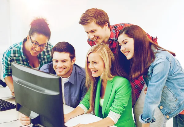 Students with computer studying at school — Stock Photo, Image