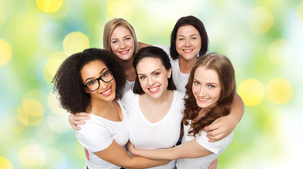 Group of happy different women in white t-shirts — Stock Photo, Image