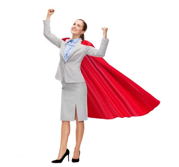 Young smiling businesswoman in red superhero cape — Stock Photo, Image