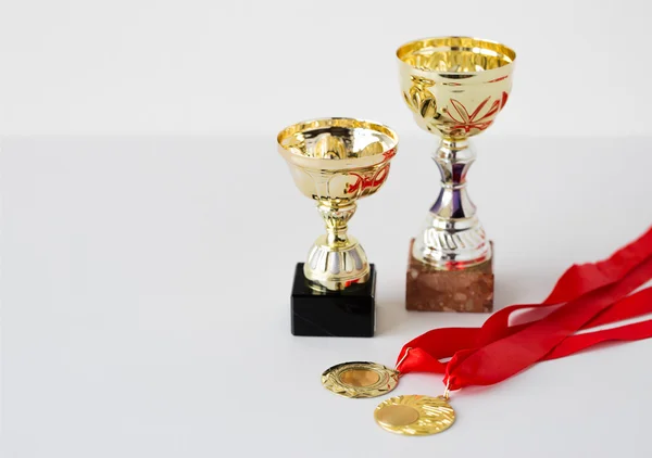 Close up of sports golden cups and medals — Stock Photo, Image